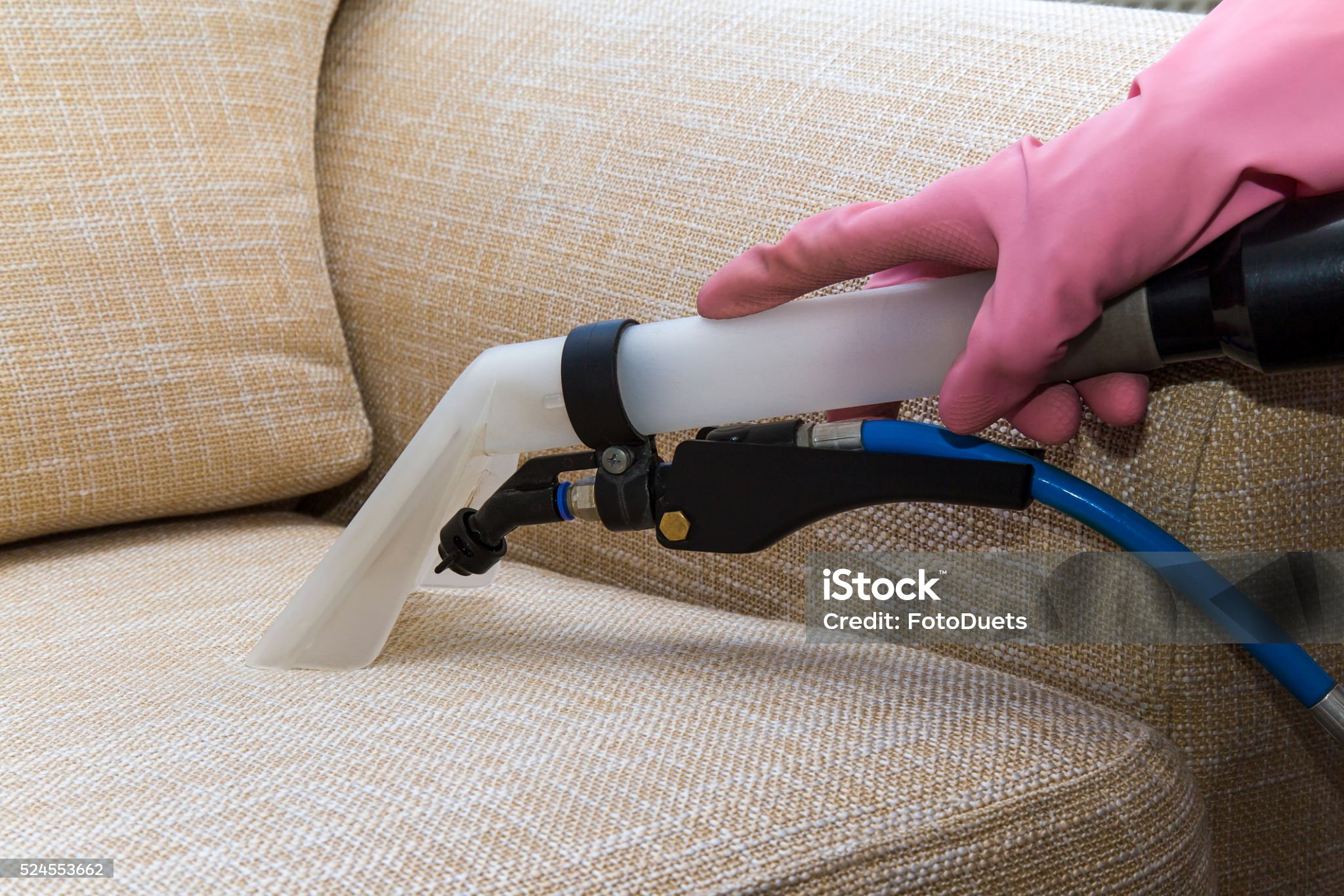 Sofa or armchair chemical cleaning with professionally extraction method. Dirty upholstered furniture. Early spring cleaning or regular clean up.